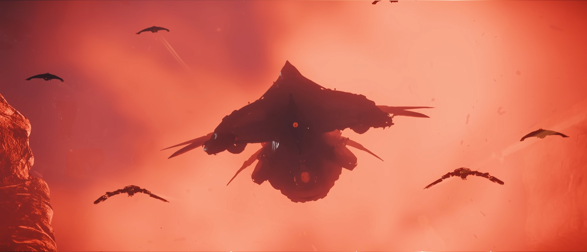 A Vanduul Mauler arrives in the Nyx system with a detachment of fighters in escort.